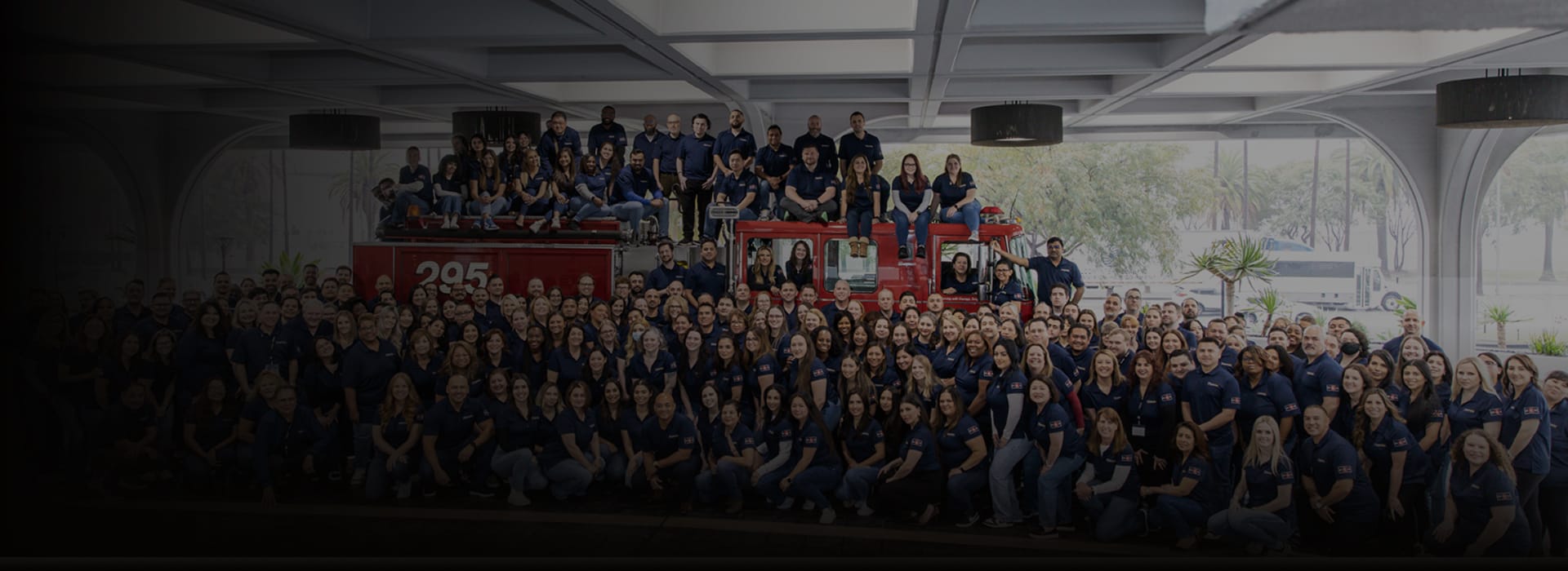 Firefighters First Credit Union Employees posed on and around a firetruck
