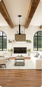 Bright living room with a fireplace, wood-beam ceiling, and large arched windows, furnished with sofas and a coffee table.