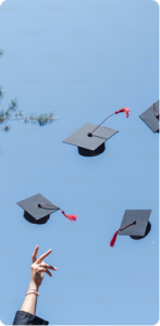 Graduation caps tossed into the air against a clear blue sky, with a hand reaching up from below.