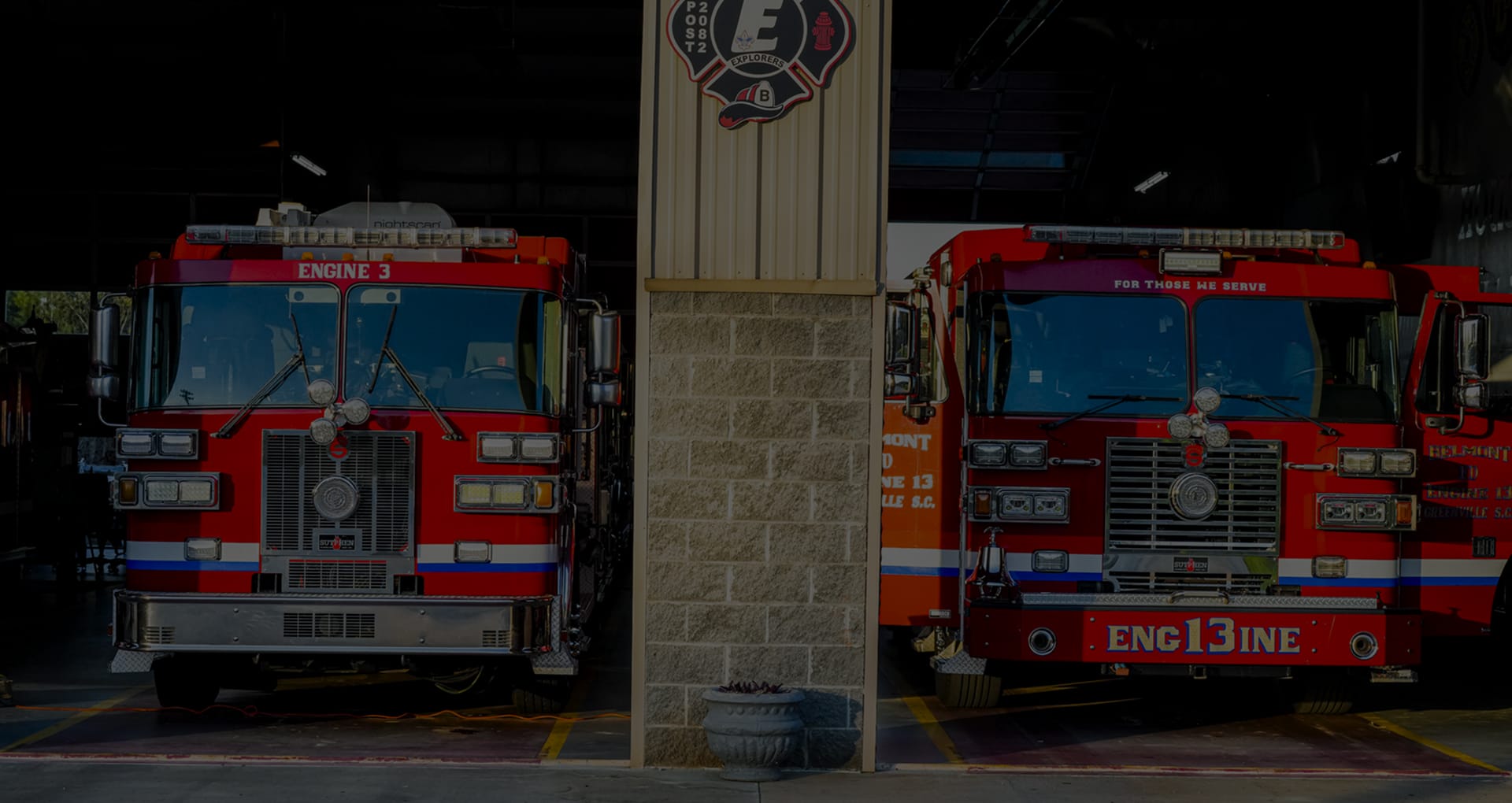 Two fire engines parked in a station