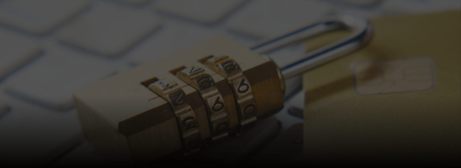 Alt text: **Padlock, credit card, and keyboard representing online payment security and account protection.**

