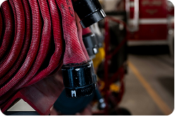 closeup photo of a red firehose