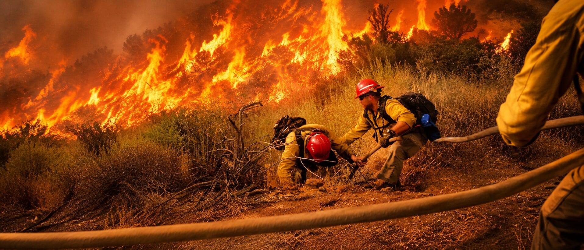 firefighters helping their colleague 