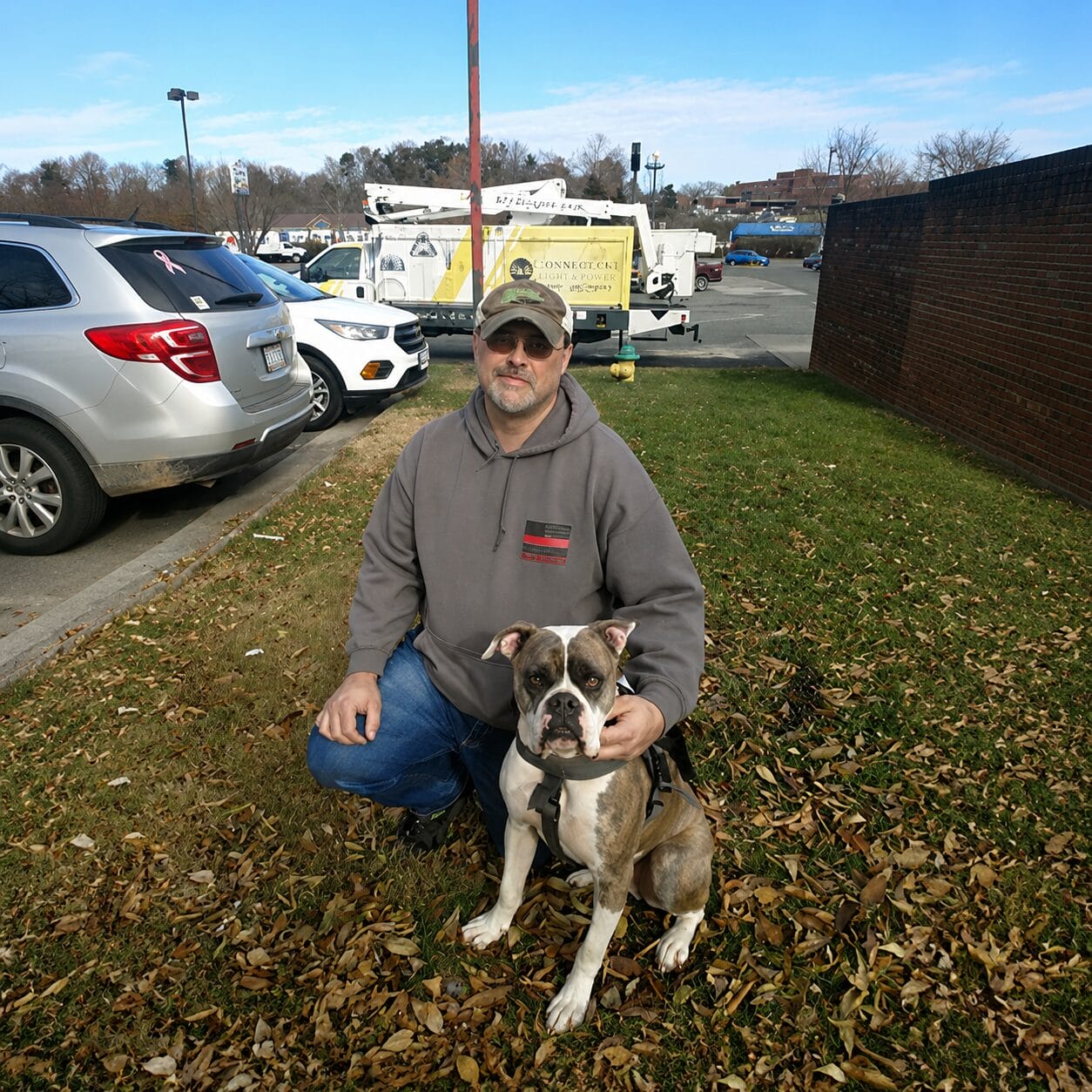 a man with his dog, outside