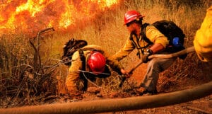 fire fighters healping each other at work