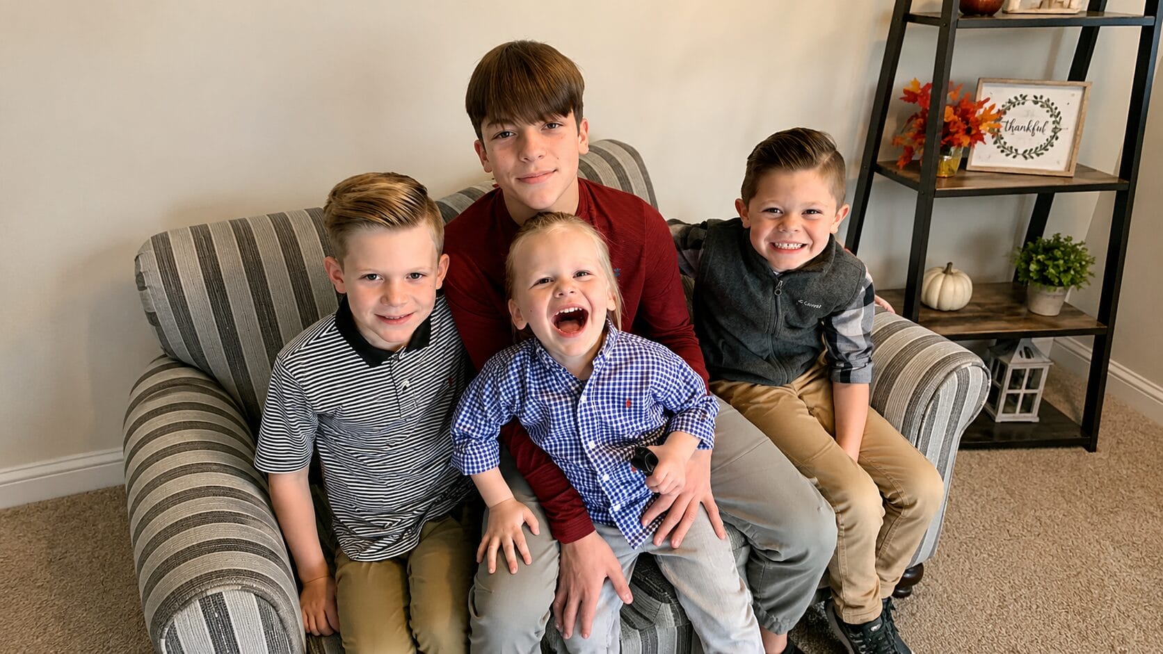 happy siblings on a sofa