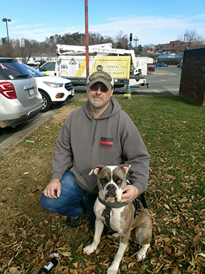 Ricky Holsclaw with service dog