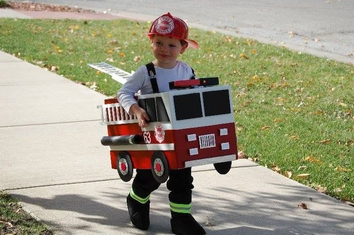a kid in firefighter costume